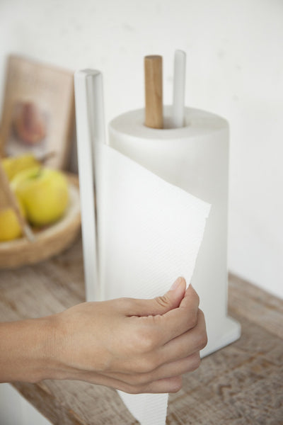 Tearing a paper towel with Yamazaki's standing paper towel holder with wooden rod and bar